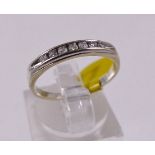 9CT DIAMOND RING. 9ct white gold diamond half eternity ring, size L