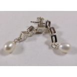 SILVER AND PEARL EARRINGS. Sterling silver C/Z and cultured pearl drop earrings