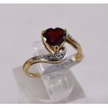 9CT GARNET AND DIAMOND RING. 9ct yellow gold garnet and diamond ring, size K/L