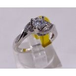 18CT DIAMOND RING. 18ct white gold 0,50ct diamond ring with 0,33ct centre stone, size J