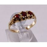 9CT GARNET RING. 9ct yellow gold garnet ring, size M