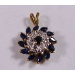 9CT DIAMOND PENDANT. 9ct gold sapphire and diamond pendant with marquise cut sapphires