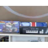 Boxed Casio keyboard, animal stamper and The Brit Mob racing game