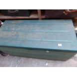 Green storage box containing horse travel boots, brushing boots and over reach boots