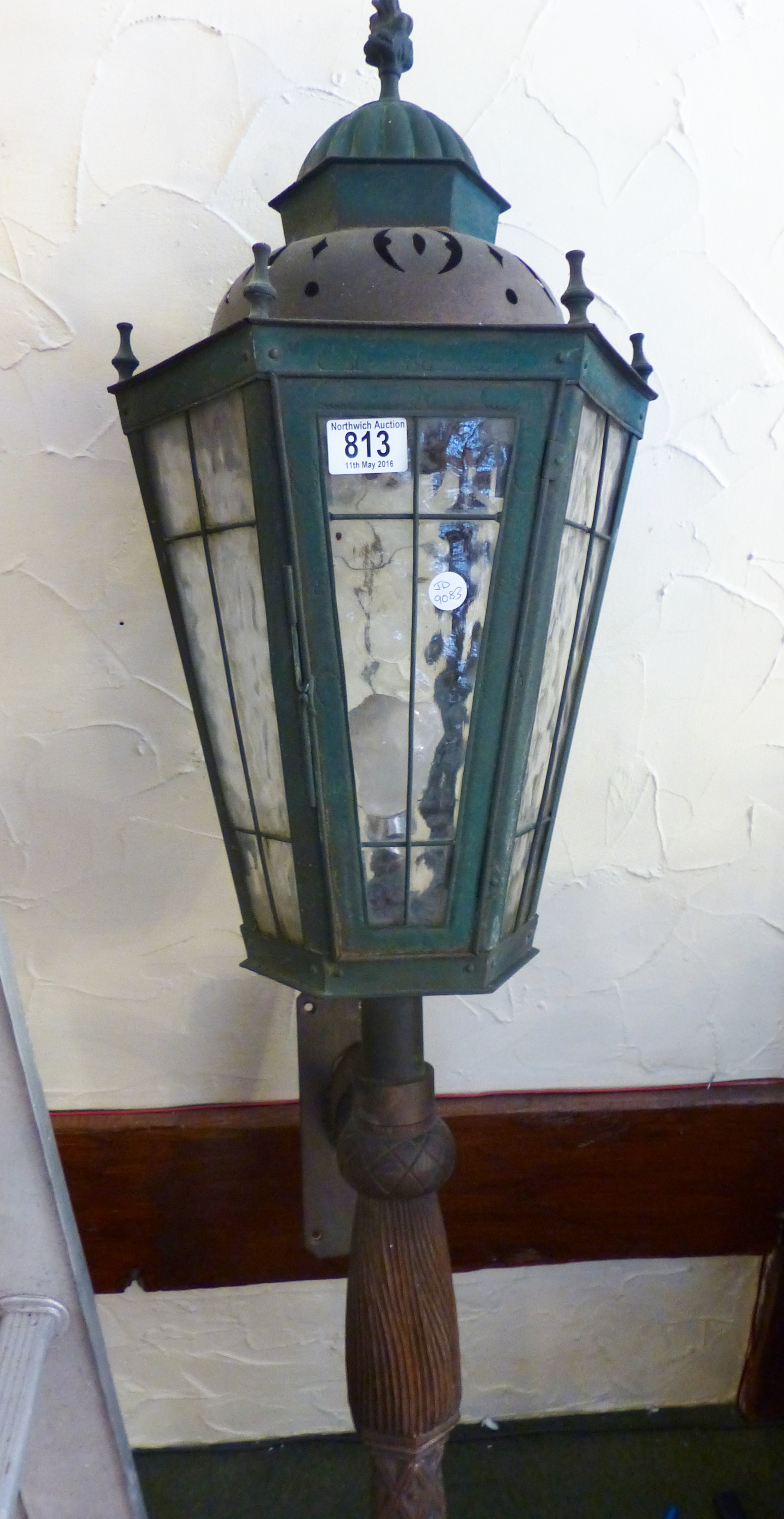 CAST METAL LIGHT. Lead glazed cast metal electric light on wooden supports