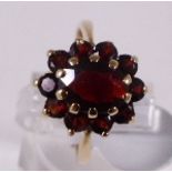 9CT CLUSTER RING. 9ct gold vintage 1970 garnet cluster ring, size P/Q