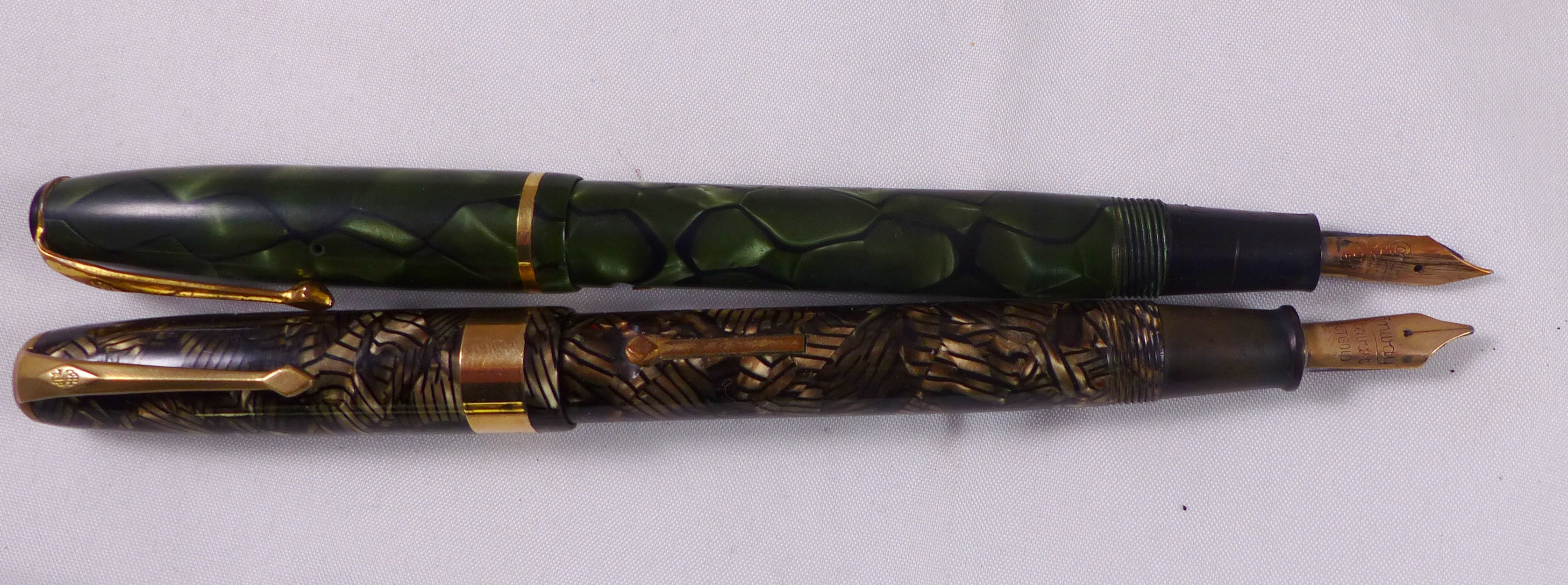 CONWAY STEWART FOUNTAIN PENS. Two Conway Stewart fountain pens with 14ct gold nibs, numbers 15 and