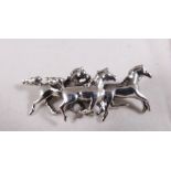 SILVER BROOCH. Stamped silver three horses brooch