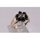 9CT CLUSTER RING. 9ct gold vintage 1979 sapphire and diamond cluster ring, size M