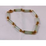 9CT AND JADE BRACELET. 9ct gold and jade bracelet