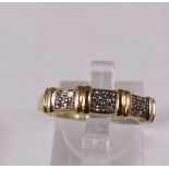 9CT BAND RING. 9ct gold twelve stone diamond band, size P