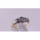 18CT HALF ETERNITY RING. 18ct yellow and white gold 0.50ct five stone diamond half eternity rub over