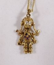 9CT ARTICULATED DOLL. 9ct gold stone set articulated doll on 9ct gold curb necklace