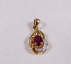 9CT GOLD PENDANT. 9ct gold synthetic ruby and diamond pendant