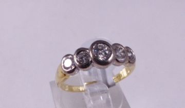 18CT HALF ETERNITY RING. 18ct yellow and white gold 0.50ct five stone diamond half eternity rub over