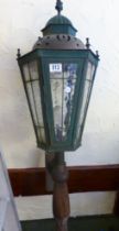 CAST METAL LIGHT. Lead glazed cast metal electric light on wooden supports