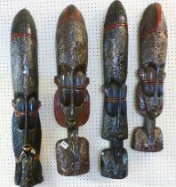 AFRICAN MASKS. Four African masks, largest H ~ 89cm