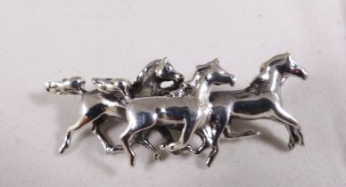 SILVER BROOCH. Stamped silver three horses brooch