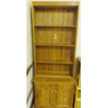 PITCH PINE UNIT. Pitch pine shelves with cupboard below, 86 x 215cm