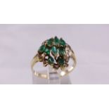 9CT DIAMOND RING 9ct gold ring set with nine marquise cut emeralds and diamonds