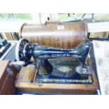 SINGER SEWING MACHINE. Oak cased Singer sewing machine