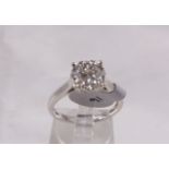 9CT DIAMOND RING. 9ct white gold 0,50ct diamond halo ring, size O