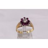 9CT DIAMOND RING. 9ct yellow gold diamond and ruby set ring, size P, 2,4g