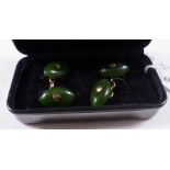 CUFFLINKS. Pair of nephrite jade and yellow metal cuflinks