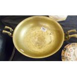 CHINESE BRASS BOWL. Chinese brass bowl with elephant feet and handles