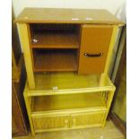 TWO CUPBOARDS. Wooden cupboard and a cane example