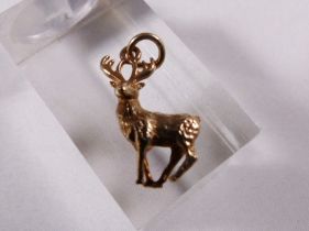 9CT STAG CHARM. 9ct gold solid stag charm