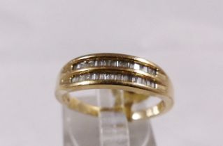 9CT DIAMOND RING. 9ct gold two row baguette cut diamond eternity ring