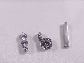 THREE SILVER PENDANTS. Three sterling silver CZ pendants