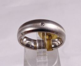 WEDDING RING. Titanium and silver wedding ring with diamond