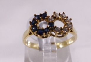 9CT SAPPHIRE RING. 9ct gold sapphire and CZ infinity ring, size N/O