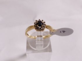 9CT SAPPHIRE AND DIAMOND RING. 9ct gold sapphire and diamond cluster ring, size O