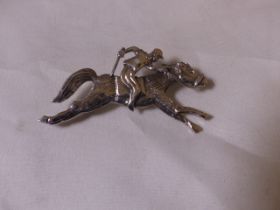 SILVER BROOCH. Stamped silver horse and rider brooch