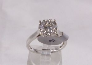 9CT DIAMOND RING. 9ct white gold 0,50ct diamond halo ring, size O