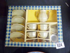 CHILDS TEASET. Boxed childs irridescent four piece teaset