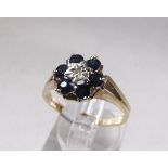 9CT SAPPHIRE AND DIAMOND RING. 9ct gold vintage sapphire and diamond cluster ring, size T