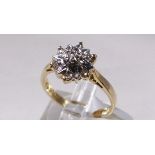 9CT DIAMOND CLUSTER RING. 9ct gold star shaped diamond cluster ring, size M/N