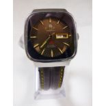 RICOH WRISTWATCH. Ricoh automatic square faced wristwatch on brown leather strap