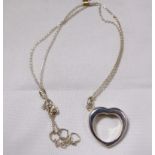 SILVER HEART PENDANT. Silver double heart pendant on silver chain