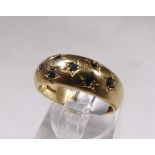 9CT SAPPHIRE BAND RING. 9ct gold sapphire set band ring, size N
