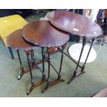 NEST OF TABLES. Nest of piecrust edged oval mahogany tables