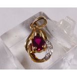 9CT PENDANT. 9ct gold synthetic ruby and diamond pendant