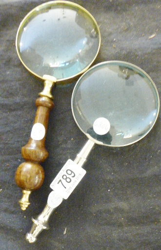 MAGNIFYING GLASSES. Wooden handled magnifying glass and stainless steel handled magnifying glass,