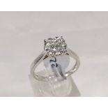 9CT DIAMOND RING. 9ct white gold 0.50ct diamond halo ring, size O