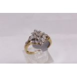 9CT CLUSTER RING. 9ct gold star shaped diamond cluster ring, size K/L