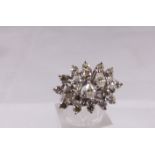 MARQUISE AND DIAMOND CLUSTER. Presumed 18ct white gold vintage marquise and round cut diamond
